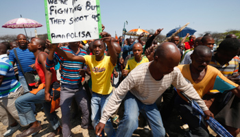 Striking platinum miners march near the Anglo-American Platinum mine near Rustenburg (REUTERS/Mike Hutchings)