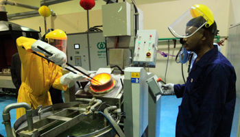 Workers process gold at the new Sudan Gold Refinery (REUTERS/Mohamed Nureldin Abdallah)