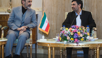 President Ahmadi-Nejad speaks with former foreign minister Ali Akbar Velayati (REUTERS/Raheb Homavandi)