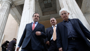 Prime Minister Antonis Samaras leaves the parliament after a meeting yesterday (REUTERS/John Kolesidis)