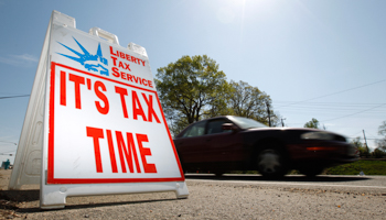 A sign advertises a tax return assistance business in Virginia (REUTERS/Kevin Lamarque)