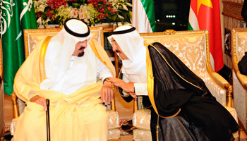 Saudi Arabia's King Abdullah speaks with Kuwaiti Emir Sheikh Sabah (REUTERS/Handout)