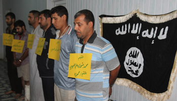 Police present suspected al-Qaeda militants in Kirkuk (REUTERS/STRINGER Iraq)