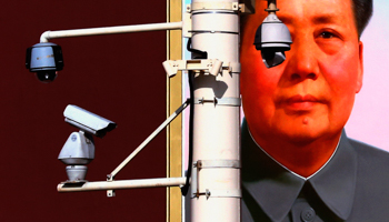 Security cameras in front of a portrait of Chairman Mao in Beijing (REUTERS/David Gray)