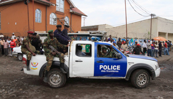 M23 rebels ride in a police truck in Goma (REUTERS/James Akena)