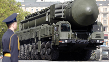 A mobile launcher carrying a Topol-M missile is driven through Moscow (REUTERS/Sergei Karpukhin)