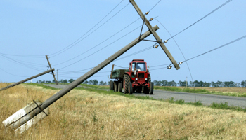 Electricity poles tipped over by a storm (REUTERS/Eduard Korniyenko)