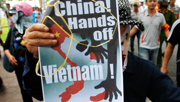 A protester holds an anti-China placard during a demonstration in Hanoi (REUTERS/STRINGER Vietnam)