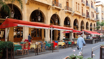 People walk past empty restaurants in the tourism district of Beirut (REUTERS/Mohamed Azakir)