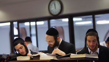 Ultra-Orthodox men study at Jerusalem's Mir Yeshiva (REUTERS/Ronen Zvulun)