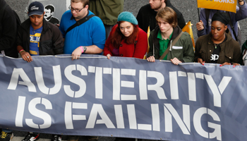 Unemployed youths attend a protest march in London (REUTERS/Suzanne Plunkett)