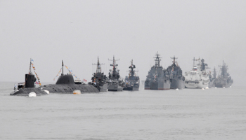 Warships and submarines line up during a rehearsal for a naval parade along the harbour of Vladivostok (REUTERS/Yuri Maltsev)