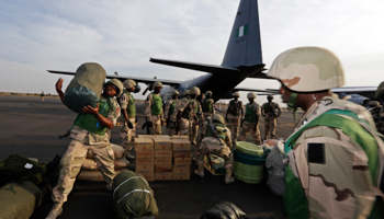 Nigerian soldiers unload their equipment as they arrive at the Mali air force base near Bamako
 (REUTERS/Eric Gaillard)