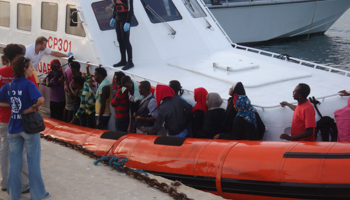 Migrants rescued by the Italian coast guard arrive in Lampedusa (REUTERS/Handout)