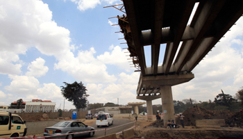 Traffic flows alongside the partly constructed Nairobi-Thika highway (REUTERS/Thomas Mukoya)