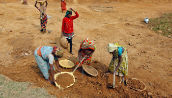 Village women work at a road construction site under the National Rural Employment Guarantee Scheme (REUTERS/Rupak De Chowdhuri)