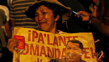 A supporter of President Hugo Chavez reacts to the announcement of his death (REUTERS/Carlos Garcia Rawlins)