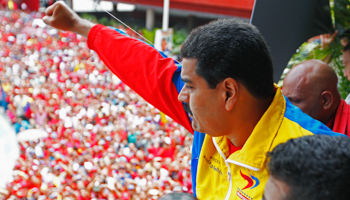 Venezuela's acting President, Nicolas Maduro, gestures to supporters (REUTERS/Carlos Garcia Rawlins)