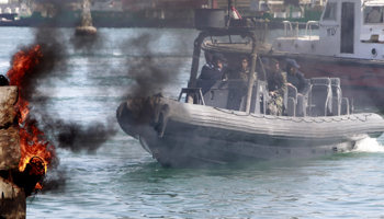 Naval units secure the area after protesters burned tyres in Port Said city (REUTERS/Mohamed Abd El Ghany)