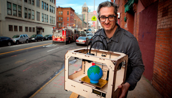 An entrepreneur holds his three-dimensional printer (REUTERS/Makerbot Industries LLC/Handout )