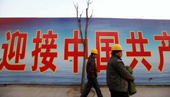 A worker stands at a construction site in Beijing (REUTERS/Jason Lee)