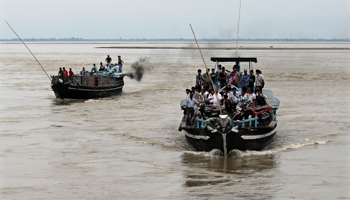 Boats travel on the Brahmaputra river in Assam state (Reuters/Stringer)