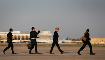 US Secretary of State John Kerry walks across the tarmac of Baghdad International Airport (Reuters/Jason Reed)