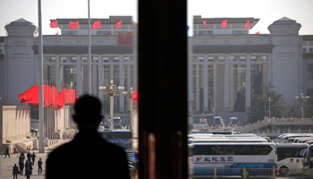 A security officer stands guard at the Great Hall of the People (Reuters/Petar Kujundzic)