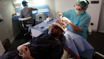 A UK medical tourist is prepared for hair transplant at a clinic in Istanbul (Reuters/Murad Sezer)
