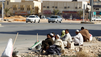 Foreign construction labourers rest on a street in Riyadh (Reuters/Fahad Shadeed)