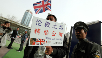 A man promotes London apartment sales at a property exhibition in Beijing (Reuters/Jason Lee)