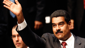 President Nicolas Maduro waves to supporters (Reuters/Carlos Garcia Rawlins)