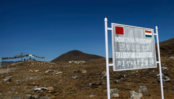 A signboard is seen from the Indian side of the Indo-China border at Bumla (Reuters/Adnan Abidi)