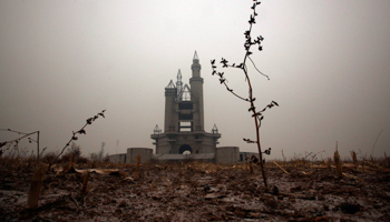 A building stands uncompleted in an abandoned amusement park near Beijing (Reuters/David Gray)