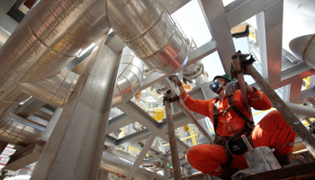 An employee works on the construction of a production platform for Petrobras (Reuters/Sergio Moraes)