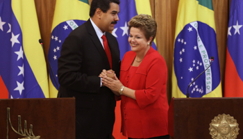 President Nicolas Maduro greets Brazilian President Dilma Rousseff  (Reuters/Ueslei Marcelino)