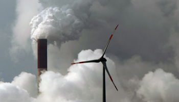 A wind turbine is seen in front of a coal power plant in Germany (Reuters/Ina Fassbender)