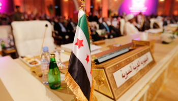 The Syrian opposition flag is seen at an Arab League summit in Doha (Reuters/Ahmed Jadallah)