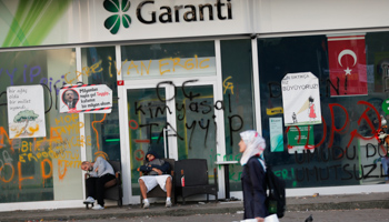 Protesters sleep outside a branch of Garanti Bank in Istanbul (Reuters/Murad Sezer)