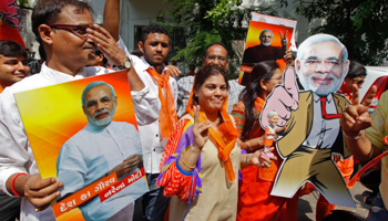 Supporters of Gujarat's Chief Minister Narendra Modi celebrate (Reuters/Amit Dave)