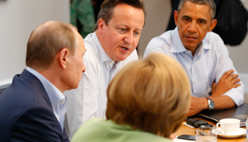 David Cameron talks with other leaders at the G8 summit (Reuters/Yves Herman)