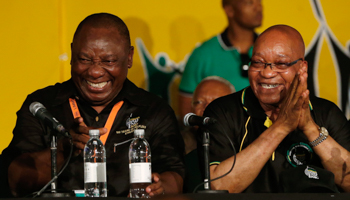 President Jacob Zuma jokes with Cyril Ramaphosa on his election as ANC deputy president (Reuters/Mike Hutchings)