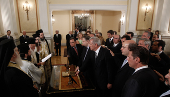 Members of the new government are sworn in at the Presidential Palace (Reuters/John Kolesidis)