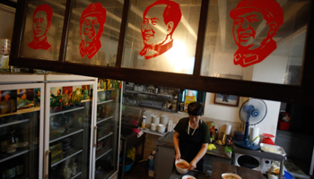 An employee works at a restaurant inspired by China's late Chairman Mao Zedong (Reuters/Kim Hong-Ji)