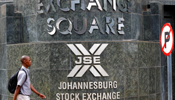 A man walks past the Johannesburg Stock Exchange building (Reuters/Siphiwe Sibeko)