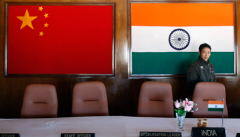 A man walks inside a conference room used for meetings between military commanders of China and India in Arunachal Pradesh (Reuters/Adnan Abidi)