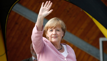 German Chancellor Angela Merkel waves during a Christian Democratic Union election campaign rally (Reuters/Fabrizio Bensch)