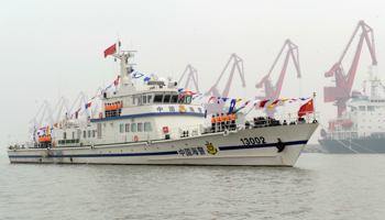 Chinese Coast Guards stand on a vessel as they patrol the sea near Huanghua port (Reuters/China Daily)