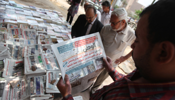 A man reads El-Watan newspaper at Tahrir square in Cairo (Reuters/Mohamed Abd El Ghany)