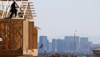 Carpenters work on new homes at a residential construction site in Las Vegas (Reuters/Steve Marcus)